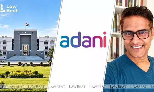 Gujarat High Court declines interim relief to journalist Ravi Nair in Adani Enterprises defamation case and reserves order on his challenge to non-bailable warrant. Gujarat High Court declines interim relief to journalist Ravi Nair in Adani Enterprises defamation case and reserves order on his challenge to non-bailable warrant.